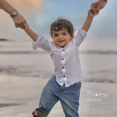There's nothing like a child's first steps on the sand, held securely by the hands of those who love him most. Our beach photoshoots are all about capturing that sense of freedom, play, and connection against the beautiful backdrop of the Mumbai seaside.