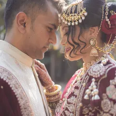 An intimate close-up of the couple, foreheads touching. This classic pose is all about showcasing the connection and love between two people.