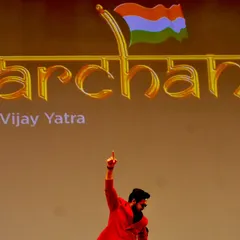 A powerful moment on stage during the 'Parcham' tour. This shot captures the feeling of leading a 'Vijay Yatra' (Victory March) for thousands of aspiring students.