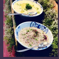 A display of our creamy hummus and baba ghanoush, drizzled with olive oil and garnished with fresh herbs. These classic dips are always a hit at corporate gatherings.