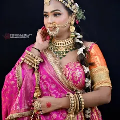 A side profile showcasing the intricate hairstyle with floral details and the stunning jewelry. The makeup is designed to harmonize with the colorful and festive vibe of the outfit.