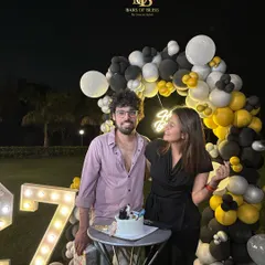 A happy client celebrating a 27th birthday with a custom cake and balloon decor I designed. Seeing these smiles is the best part of my job.