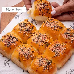 Our soft, pull-apart Mutton Buns are a savory delight. The fluffy buns are filled with spiced mutton and topped with sesame seeds for extra flavor and texture.
