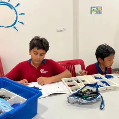 Students from Vidyashilp Academy focused on their workbooks during our LEGO Education after-school program. We emphasize understanding the theory behind the build.