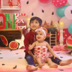 Big brother and little sister sharing a sweet moment. Sibling photos are a wonderful way to celebrate the family bond.