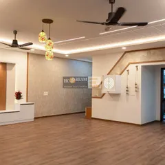 Another angle of the spacious living area, showing the seamless integration of the dining space and kitchen entrance. The consistent lighting and color scheme create a cohesive and welcoming home.