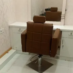 This is one of my styling stations, complete with a comfortable, adjustable chair and a large mirror. This is where the final transformation and haircut take place.