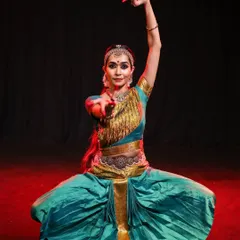 The Aramandi, or half-seated posture, is fundamental to Bharatanatyam. This image shows the full form, combining grace with the strength required for the dance.
