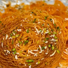 We love to offer unique options like this traditional Ghevar, garnished with pistachios and almonds. This specialty dessert is perfect for clients who want to add an element of surprise to their festive menu or gift boxes.