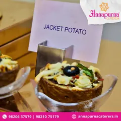 A close-up of our innovative Jacket Potato appetizer. It’s a classic comfort food reimagined as a bite-sized, flavour-packed starter for modern events.