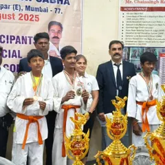 I stand proudly with my students, who are displaying the medals they won at the state-level tournament. Seeing them succeed is my greatest reward.