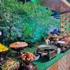 A vibrant and colorful spread at our live chaat counter. Here you can see pani puri, sev puri, and various chutneys and toppings, all ready for guests to customize their favorite street food snack.