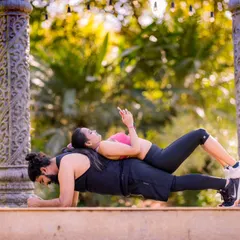 A creative and fun pose during a fitness-themed shoot. This shows that your pre-wedding photos can truly reflect your shared hobbies and passions.