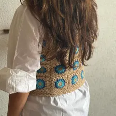 The back view of the granny square vest. The pattern is consistent all the way around, ensuring the piece looks great from every angle.
