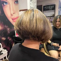 The back view shows the precise stacking and layering that gives an inverted bob its signature volume and shape.