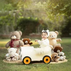 A whimsical teddy bear picnic in the great outdoors. The natural setting adds a layer of magic and authenticity to this classic, sweet theme.