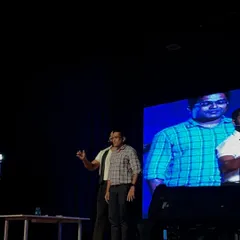 Interacting with an audience member during my TEDxSABVMCRI performance. Getting participants involved is crucial to demonstrating the principles of psychology and perception that I discuss in my talks.