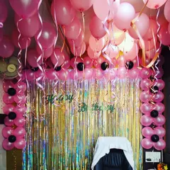 An office birthday celebration made special with a full decorative setup. I used pink balloons for the ceiling and pillars, paired with a shimmering foil curtain to create a festive photo corner and make the team member feel valued.
