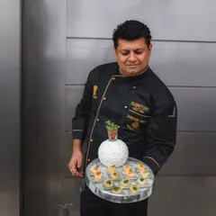 Celebrity Chef Lalit Tuli presenting a tray of his innovative creations. This is the culinary perfection we bring from our kitchen to your event.
