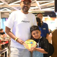 Another happy pair from our Father's Day event. This son created a vibrant, personalized plaque for his dad.
