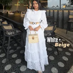 An elegant and clean summer color combination: white and beige. This all-white lace dress is beautifully complemented by a beige belt and a straw bag, creating a sophisticated 'old money' aesthetic.