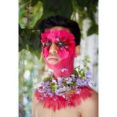 A close-up of the floral makeup concept, focusing on the intricate details and the raw emotion in the subject's eyes.