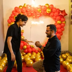 The moment that changes everything. We create the perfect, intimate setting for you to pop the question, complete with a romantic heart-shaped balloon arch and a "Marry Me" neon sign to capture the perfect "yes".