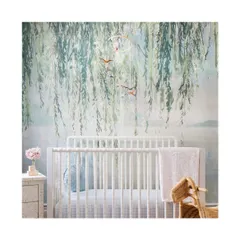 This nursery features a digitally printed, textured wallcovering of sweeping willow leaves. The serene and gentle design from Phillip Jeffries creates a calming and magical environment for a child's room, available in seven beautiful colorways.