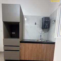 We also design dedicated utility areas to keep your home organized. This unit features a space for the water purifier and additional storage, seamlessly integrated with the main kitchen design.