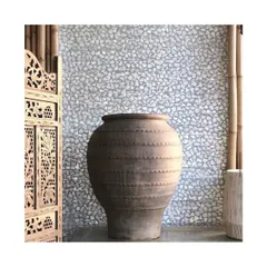 This unique wallcovering is made from natural Capiz shell flakes, hand-woven to form a mosaic. I use such materials to bring an element of the natural world indoors, creating a surface that shimmers and catches the light beautifully.