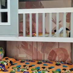 For this bunk bed setup, I installed a subtle pink tropical leaf wallpaper. It adds a touch of fun and color to the sleeping nook, making it a cozy and personalized space.