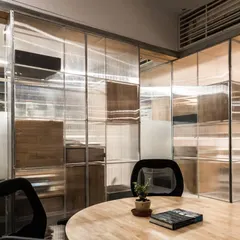 This New Delhi office demonstrates our concept of 'dematerialization'. We transformed solid walls and storage units into translucent, light-emitting devices to open up the floor plan and maximize natural light.