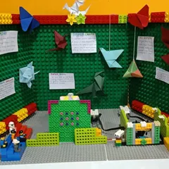 An origami-themed project by the 'Orikata Explorers' for the FLL competition. This build combines art with technology, using LEGO robotics to create an automated paper craft display.