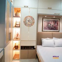 This design shows how a mandir can be elegantly incorporated into a bedroom wardrobe. I used a beautiful "Om" mandala on the cabinet door, which opens to a dedicated, warmly lit niche for prayer. This solution provides a personal spiritual corner without requiring a separate room.