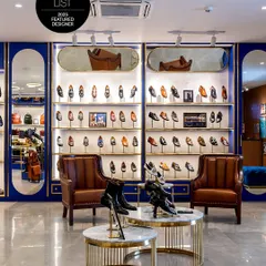 A space where craftsmanship meets design. The sleek, illuminated shoe wall, warm leather armchairs, and nested marble tables create an immersive retail experience for the modern shopper at Brune & Bareskin.