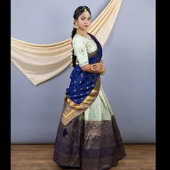 A side view of the South Indian style lehenga, highlighting the rich texture of the silk and the heavy zari border.