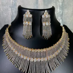 A still image of the unique dual-tone fringe necklace. This piece is perfect for anyone looking to rent contemporary party jewellery that stands out from the crowd.