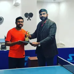 Celebrating a champion at our prize money tournament. We believe in rewarding skill and dedication, with trophies and cash prizes for top performers.