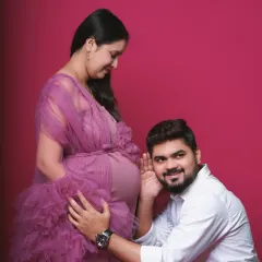 A playful and loving studio pose where the father-to-be listens to the baby bump. This is a classic and heartwarming shot that I love to capture for expecting couples.