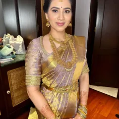 The complete engagement look, showcasing the beautiful saree, temple jewelry, and timeless makeup.