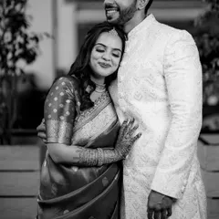 A moment of quiet comfort and love. This black and white photo of Ojasi and Rutvik from their Pune engagement emphasizes the texture of their traditional attire and the peacefulness of their embrace.