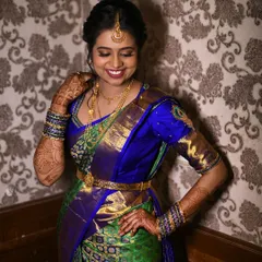 The joy on her face is everything. For her engagement, I created a classic South Indian look with soft, glowing makeup and a bright lip that perfectly matched the vibrant colors of her Kanchipuram silk saree.