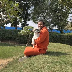A happy, smiling dog is the best feedback I can get. This photo captures the trusting relationship I build with each bachha that stays with me.
