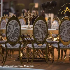 We focus on quality and design in every element. These beautiful chairs feature intricate gold frames and elegant paisley-patterned upholstery, providing a luxurious seating experience for your guests.