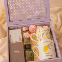 This 'His & Hers' hamper is perfect for newlyweds or as an anniversary gift. It features matching floral and "main squeeze" mugs, along with mini perfumes and shower gels from Zara and Bath & Body Works, all presented in a beautiful lilac cane box.