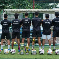 The backbone of our success. Our licensed coaches stand united, guiding our players with expertise and passion. Their dedication is reflected in the trophies at their feet.