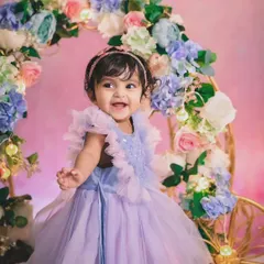 Every little girl deserves a Cinderella moment. This beautiful studio setup with a floral carriage and a stunning lavender dress creates a fairytale portrait she will always treasure.