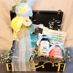 A sophisticated gift hamper for the Groom To Be. This black trunk is filled with premium grooming products, snacks, and a personal note to congratulate him on the new beginning.