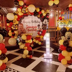 A full view of the Mickey Mouse birthday celebration setup. We manage everything from the main backdrop to smaller balloon pillars, ensuring a visually stunning party space.