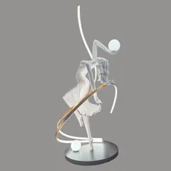 We capture movement and grace in this unique floor lamp. The sculpture of a dancing figure is intertwined with a ribbon of light, creating a sense of fluid motion and turning a simple corner into a stage for art.